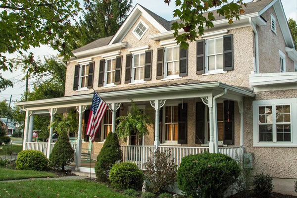 Farmhouse with Wooden Exterior Shutters